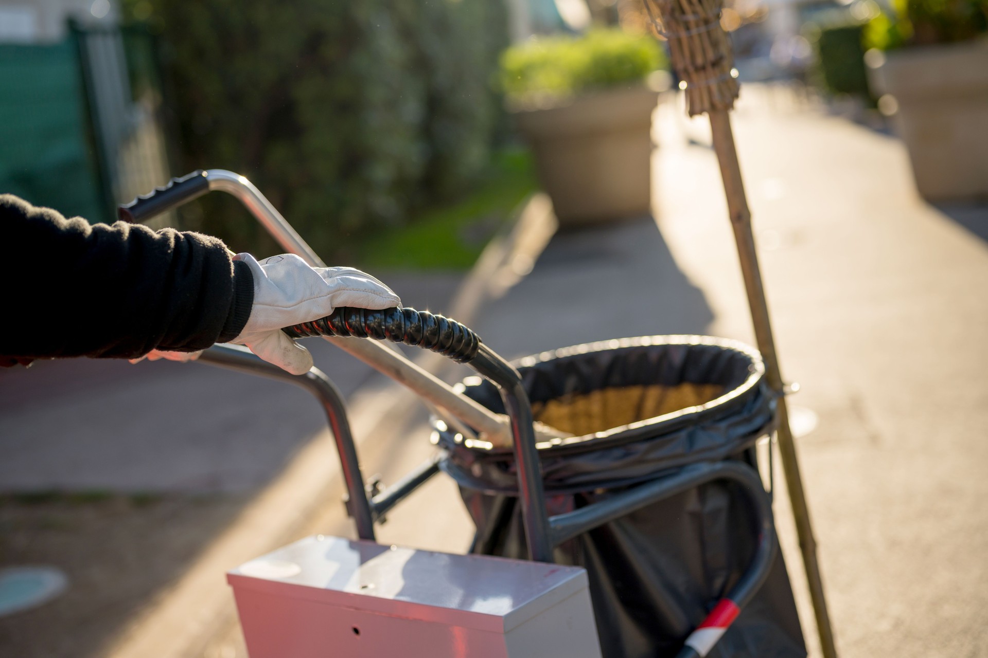 Pushing garbage bin